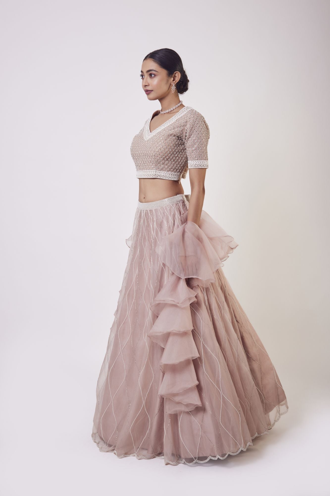 Shop stunning peach organza lehenga online in USA with ruffle dupatta. Get festive ready in beautiful designer Anarkali suits, designer lehenga, wedding gowns, sharara suits, designer sarees from Pure Elegance Indian fashion store in USA.-full view