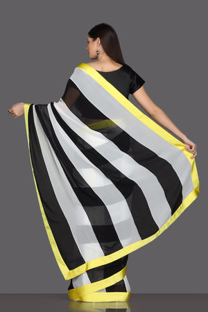 Shop elegant black and white striped saree online in USA with embroidered saree blouse. Make a fashion statement at parties with stunning designer sarees from Pure Elegance Indian fashion store in USA.-back