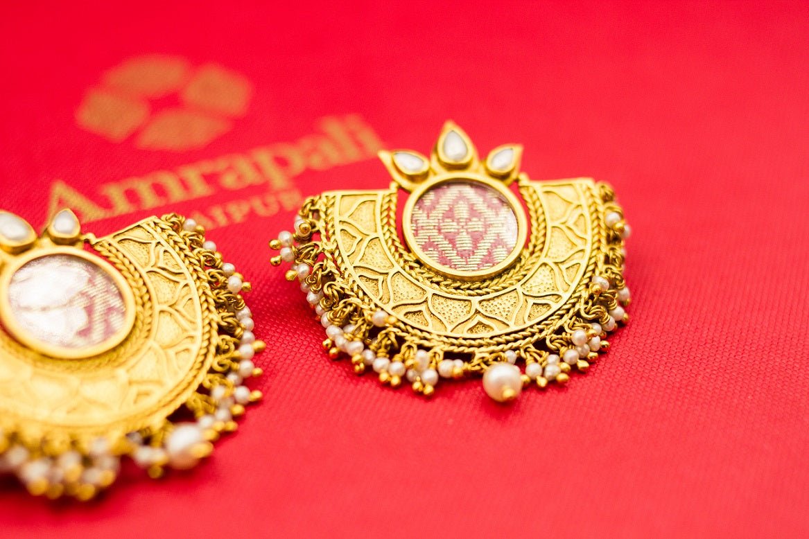 Shop Amrapali silver gold plated crescent shape earrings online in USA with pearls. Raise your ethnic style quotient on special occasions with exquisite Indian jewelry from Pure Elegance Indian clothing store in USA. Enhance your Indian look with silver gold plated jewelry, necklaces, fashion jewelry available online.-side