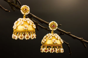 Buy Amrapali silver gold plated pearl flowers jhumka earrings online in USA. Raise your ethnic style quotient on special occasions with exquisite Indian jewelry from Pure Elegance Indian clothing store in USA. Enhance your Indian look with silver gold plated jewelry, necklaces, fashion jewelry available online.-closeup