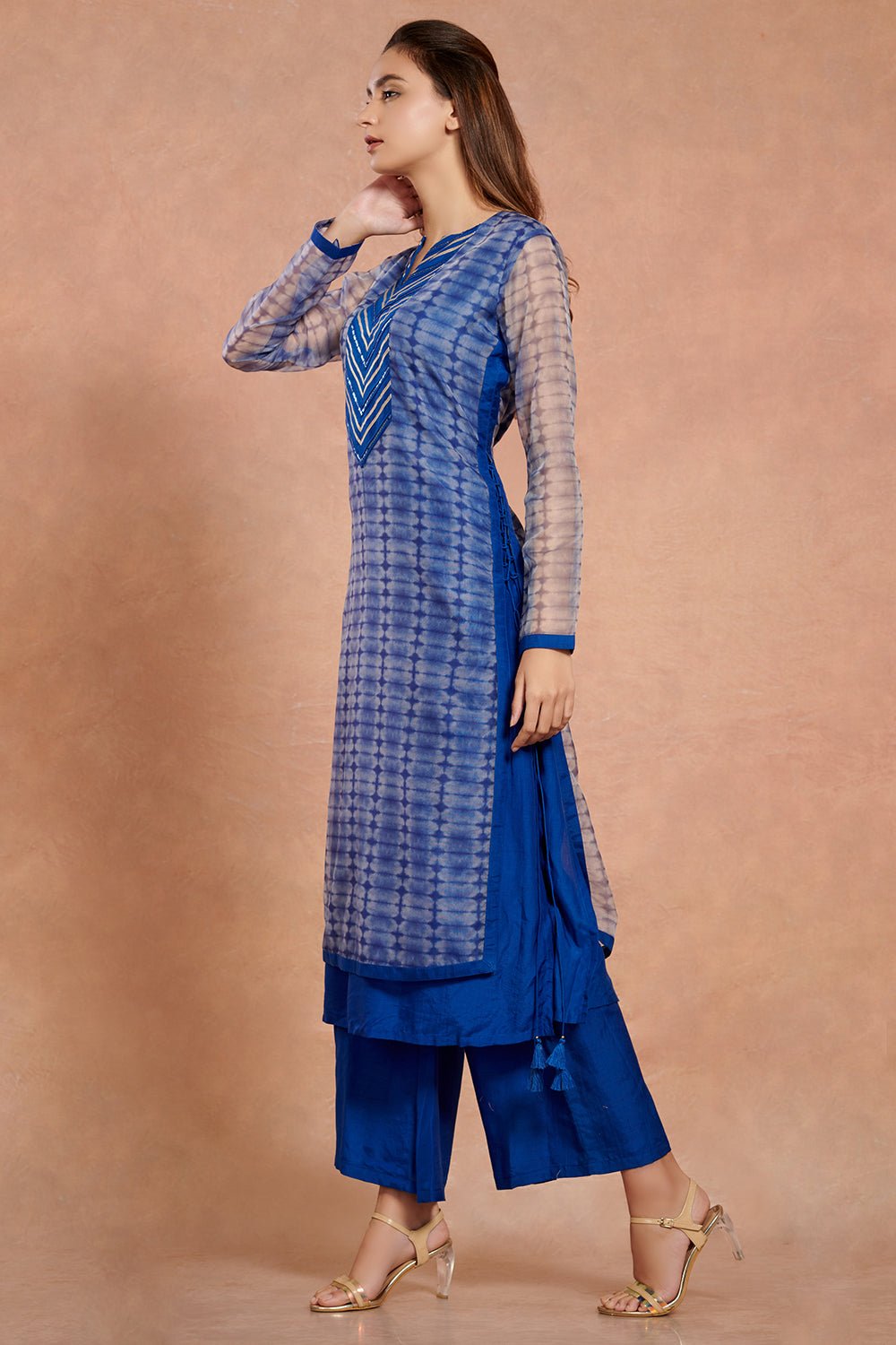 Shop stunning cobalt blue muslin kurta set online in USA with palazzo. Make a fashion statement on festive occasions and weddings with palazzo suits, sharara suits, partywear dresses, salwar suits from Pure Elegance Indian fashion store in USA.-side