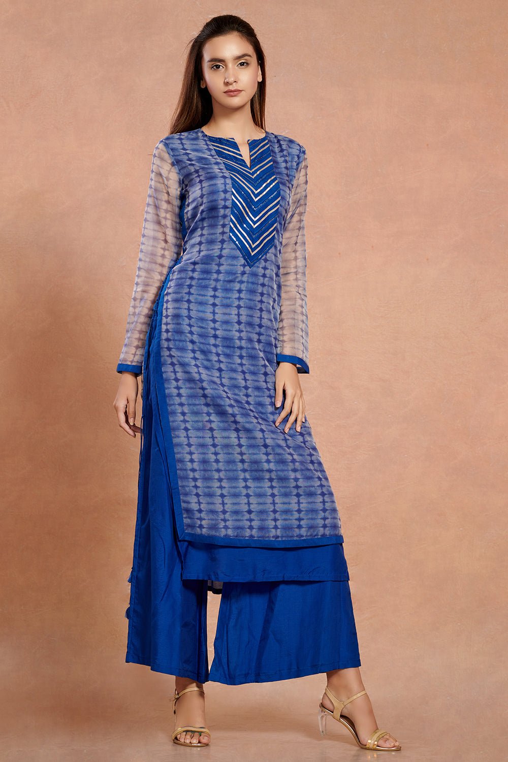 Shop stunning cobalt blue muslin kurta set online in USA with palazzo. Make a fashion statement on festive occasions and weddings with palazzo suits, sharara suits, partywear dresses, salwar suits from Pure Elegance Indian fashion store in USA.-front