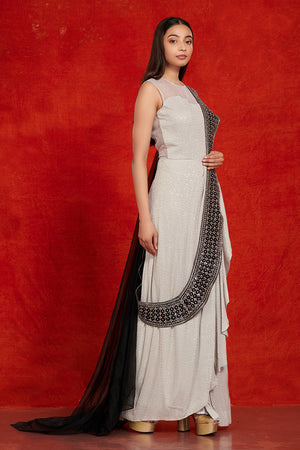 Buy stunning grey and black embellished saree gown online in USA. Make a fashion statement on festive occasions and weddings with palazzo suits, sharara suits, partywear dresses, salwar suits from Pure Elegance Indian fashion store in USA.-right