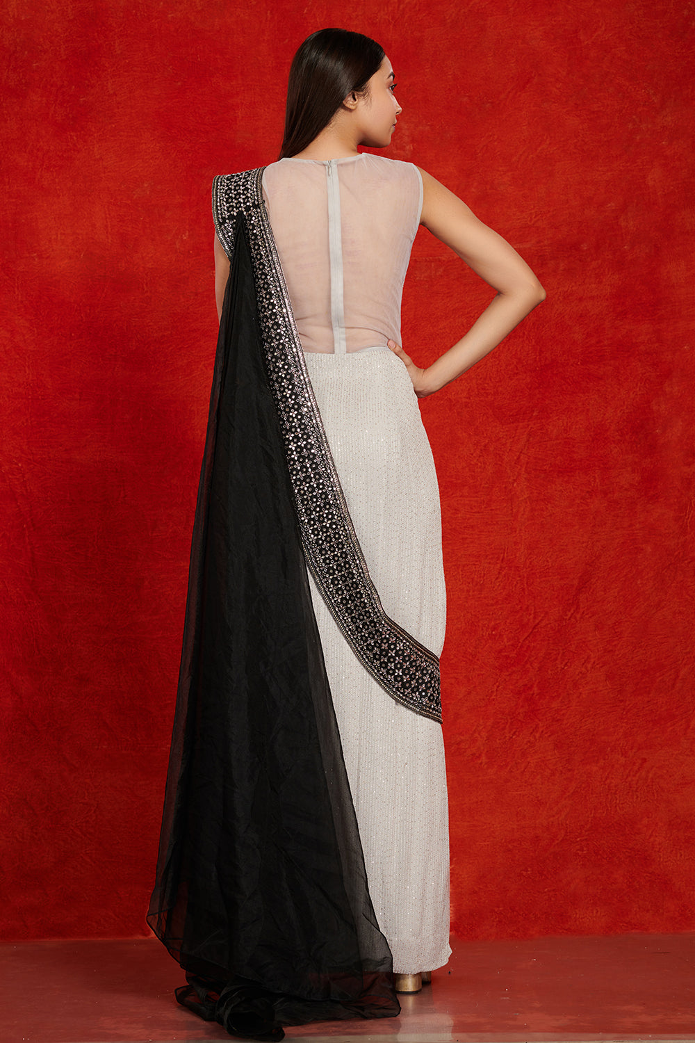 Buy stunning grey and black embellished saree gown online in USA. Make a fashion statement on festive occasions and weddings with palazzo suits, sharara suits, partywear dresses, salwar suits from Pure Elegance Indian fashion store in USA.-back
