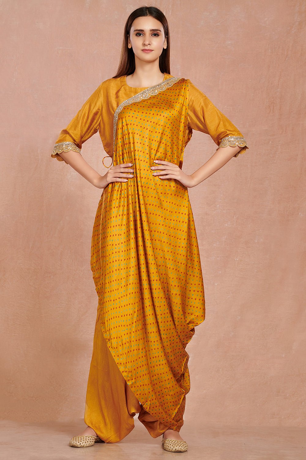 Shop gorgeous mustard silk jumpsuit online in USA with printed attached drape. Make a fashion statement on festive occasions and weddings with designer suits, Indian dresses, Anarkali suits, palazzo suits, designer gowns, sharara suits from Pure Elegance Indian fashion store in USA.-full view