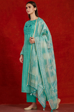 Shop gorgeous teal chanderi suit set online in USA with tie and dye dupatta. Make a fashion statement on festive occasions and weddings with palazzo suits, sharara suits, partywear dresses, salwar suits from Pure Elegance Indian fashion store in USA.-side