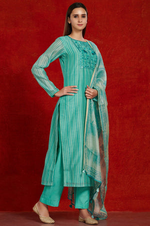 Shop gorgeous teal chanderi suit set online in USA with tie and dye dupatta. Make a fashion statement on festive occasions and weddings with palazzo suits, sharara suits, partywear dresses, salwar suits from Pure Elegance Indian fashion store in USA.-left