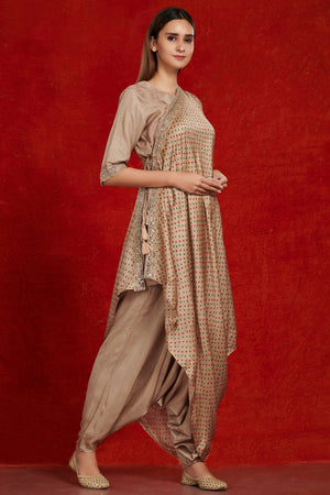Shop stunning beige printed jumpsuit online in USA with printed drape. Make a fashion statement on festive occasions and weddings with palazzo suits, sharara suits, partywear dresses, salwar suits from Pure Elegance Indian fashion store in USA.-right