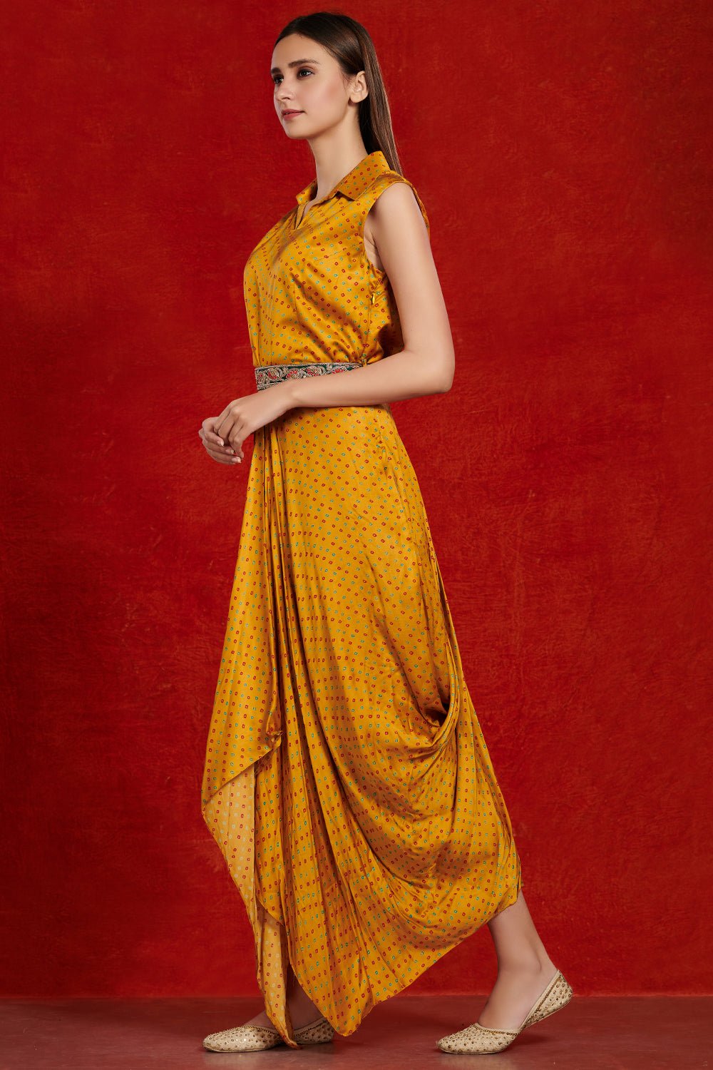 Buy beautiful mustard bandhej print jumpsuit online in USA with embroidered belt. Make a fashion statement on festive occasions and weddings with designer suits, Indian dresses, Anarkali suits, palazzo suits, designer gowns, sharara suits from Pure Elegance Indian fashion store in USA.-side