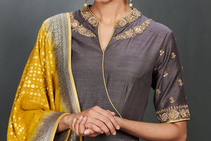 Buy stunning grey embroidered floorlength Anarkali online in USA with mustard dupatta. Make a fashion statement on festive occasions and weddings with palazzo suits, sharara suits, partywear dresses, salwar suits from Pure Elegance Indian fashion store in USA.-neckline