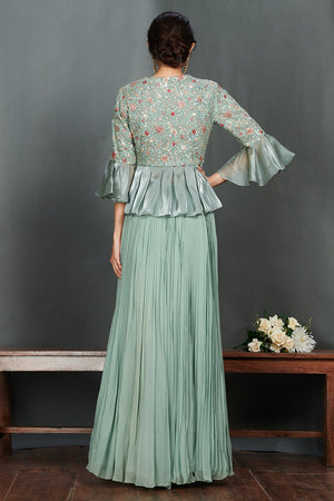 Shop beautiful aqua green peplum blouse online in USA with pleated georgette skirt. Make a fashion statement on festive occasions and weddings with designer suits, Indian dresses, Anarkali suits, palazzo suits, designer gowns, sharara suits from Pure Elegance Indian fashion store in USA.-back