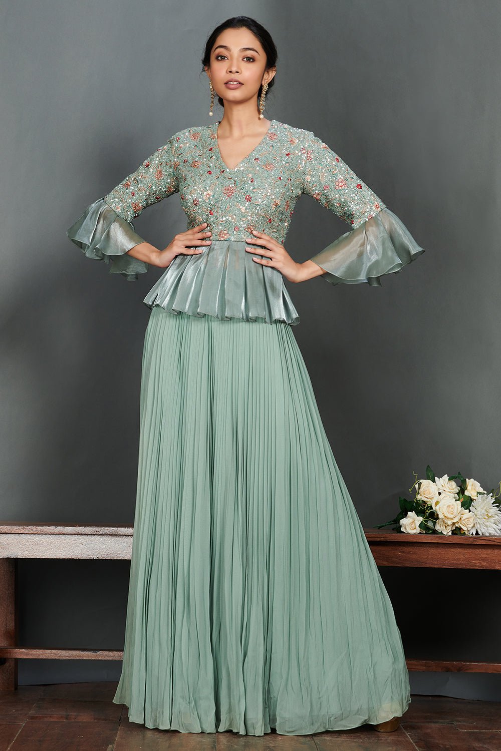 Shop beautiful aqua green peplum blouse online in USA with pleated georgette skirt. Make a fashion statement on festive occasions and weddings with designer suits, Indian dresses, Anarkali suits, palazzo suits, designer gowns, sharara suits from Pure Elegance Indian fashion store in USA.-full view