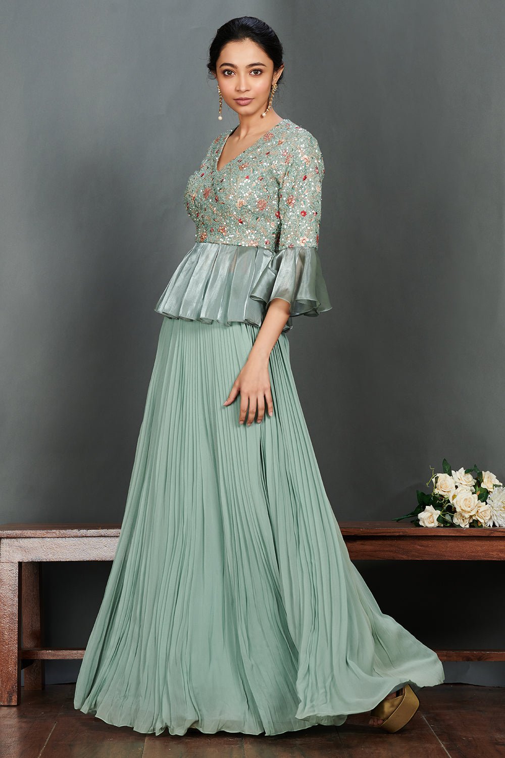 Shop beautiful aqua green peplum blouse online in USA with pleated georgette skirt. Make a fashion statement on festive occasions and weddings with designer suits, Indian dresses, Anarkali suits, palazzo suits, designer gowns, sharara suits from Pure Elegance Indian fashion store in USA.-left