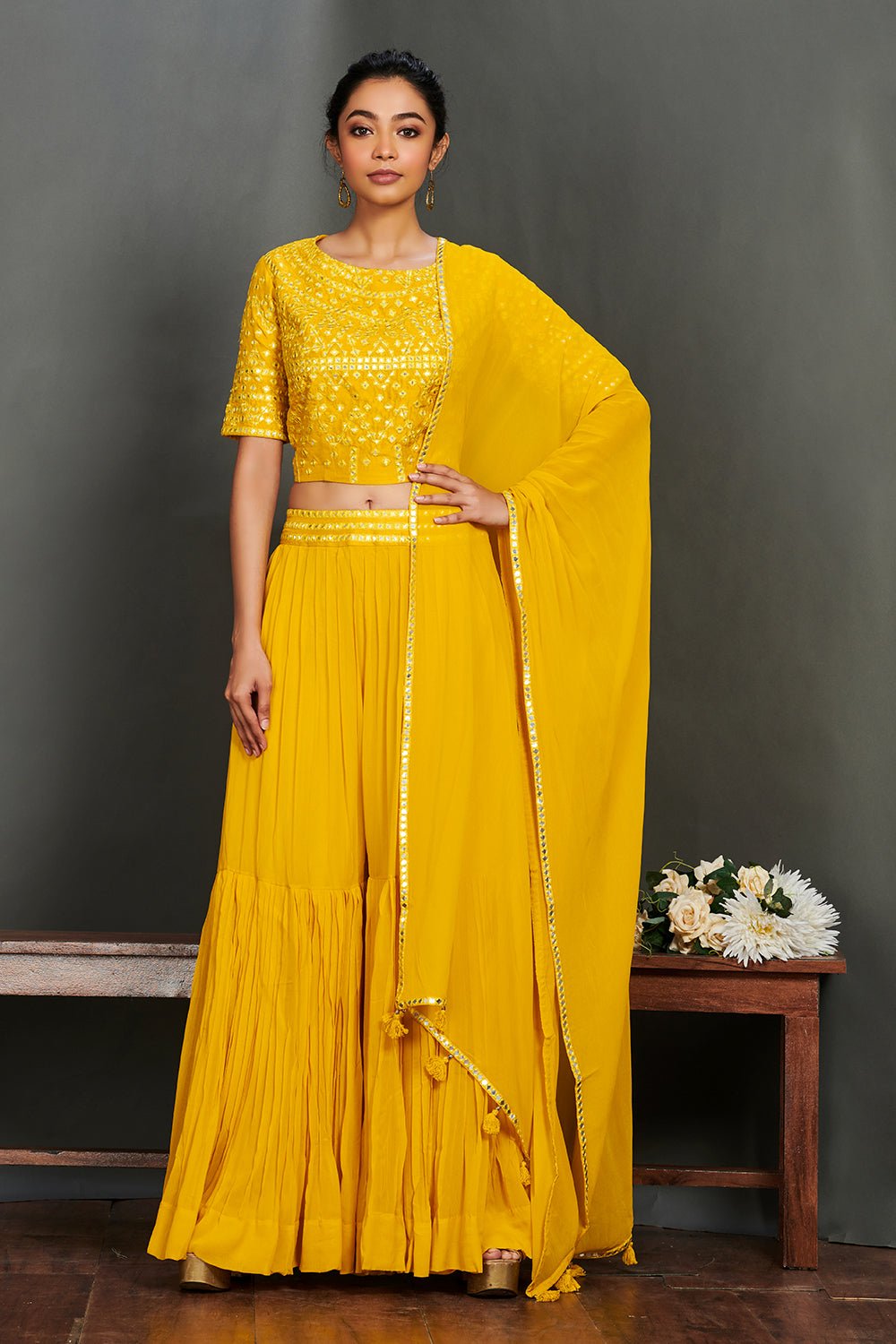 Shop gorgeous yellow mirror work sharara suit online in USA with dupatta.  Make a fashion statement on festive occasions and weddings with designer suits, Indian dresses, Anarkali suits, palazzo suits, designer gowns, sharara suits from Pure Elegance Indian fashion store in USA.-front