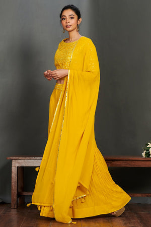 Shop gorgeous yellow mirror work sharara suit online in USA with dupatta.  Make a fashion statement on festive occasions and weddings with designer suits, Indian dresses, Anarkali suits, palazzo suits, designer gowns, sharara suits from Pure Elegance Indian fashion store in USA.-right