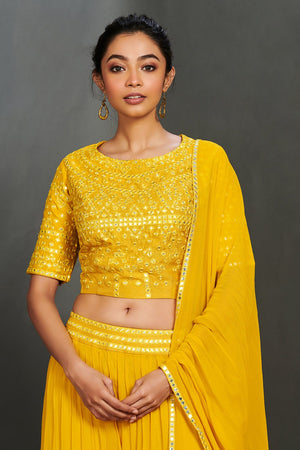 Shop gorgeous yellow mirror work sharara suit online in USA with dupatta.  Make a fashion statement on festive occasions and weddings with designer suits, Indian dresses, Anarkali suits, palazzo suits, designer gowns, sharara suits from Pure Elegance Indian fashion store in USA.-closeup