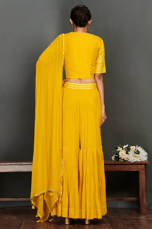 Shop gorgeous yellow mirror work sharara suit online in USA with dupatta.  Make a fashion statement on festive occasions and weddings with designer suits, Indian dresses, Anarkali suits, palazzo suits, designer gowns, sharara suits from Pure Elegance Indian fashion store in USA.-back
