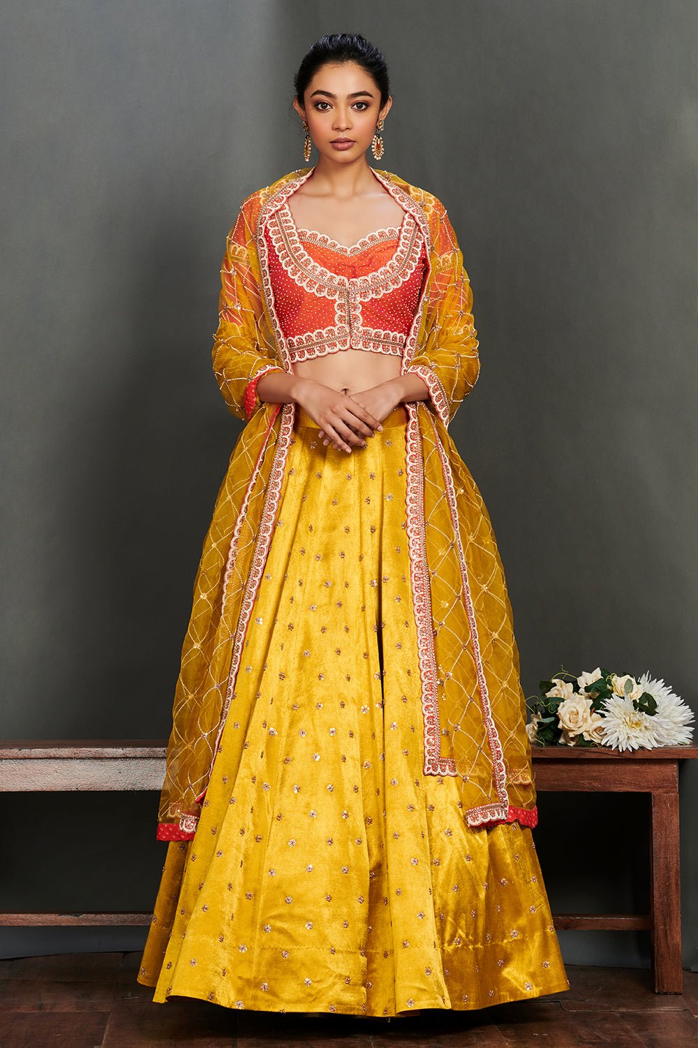 Shop gorgeous yellow embroidered cotton lehenga online in USA with coral choli. Make a fashion statement on festive occasions and weddings with palazzo suits, sharara suits, partywear dresses, salwar suits from Pure Elegance Indian fashion store in USA.-full view