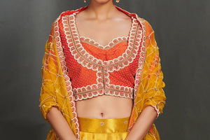 Shop gorgeous yellow embroidered cotton lehenga online in USA with coral choli. Make a fashion statement on festive occasions and weddings with palazzo suits, sharara suits, partywear dresses, salwar suits from Pure Elegance Indian fashion store in USA.-neckline