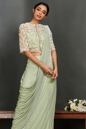 Buy beautiful mint green georgette saree online in USA with sheet jacket saree blouse. Make a fashion statement on festive occasions and weddings with palazzo suits, sharara suits, partywear dresses, salwar suits from Pure Elegance Indian fashion store in USA.-closeup