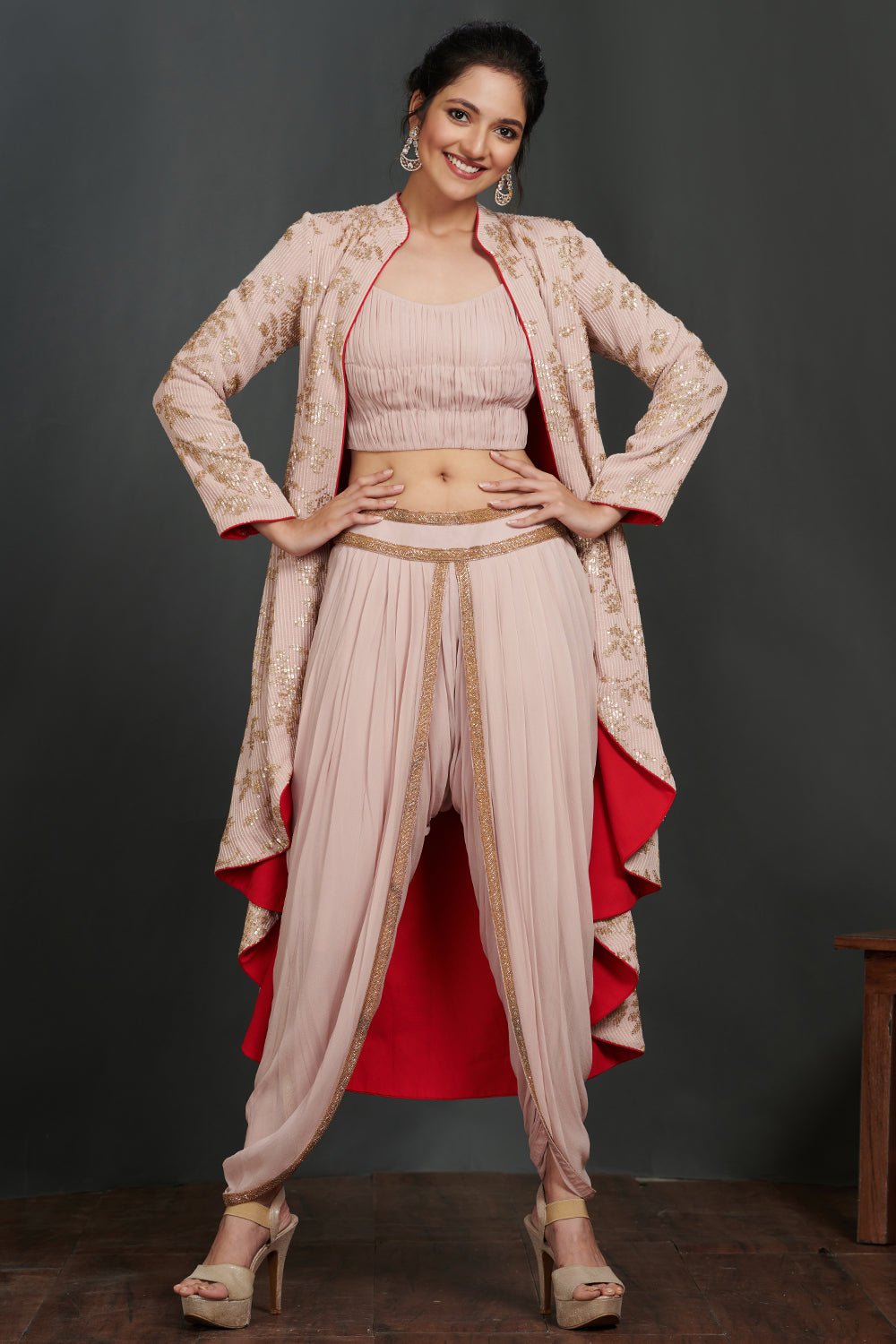 Shop stunning rose pink crop top and pant set online in USA with jacket. Make a fashion statement on festive occasions and weddings with palazzo suits, sharara suits, partywear dresses, salwar suits from Pure Elegance Indian fashion store in USA.-front