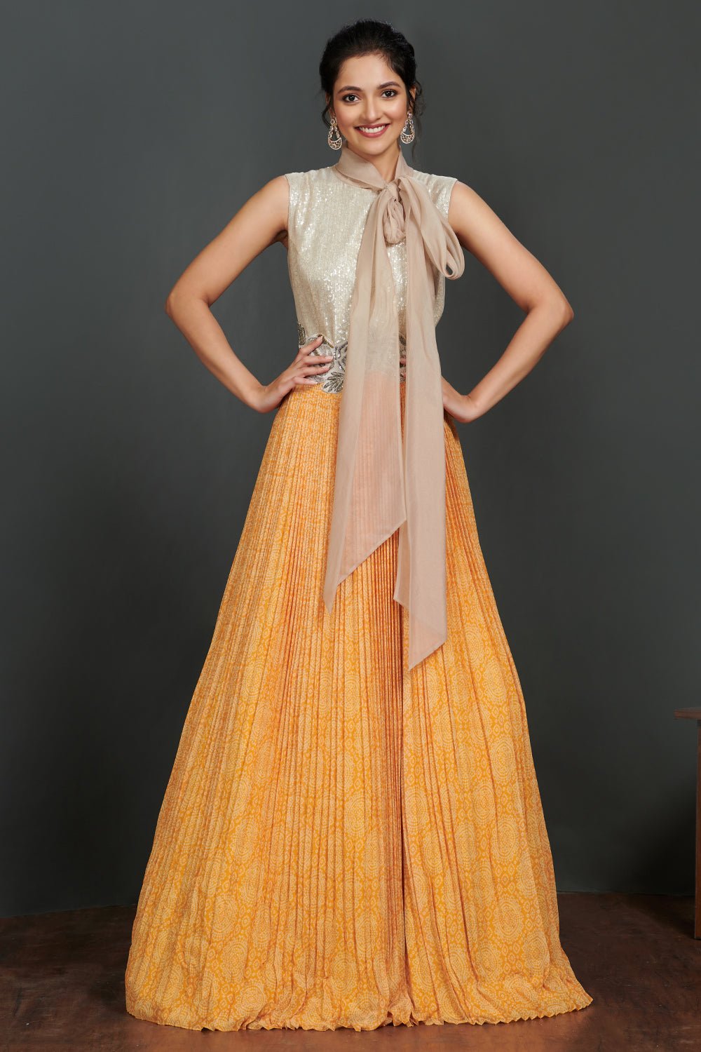 Shop beautiful silver and light orange pleated gown online in USA with scarf. Make a fashion statement on festive occasions and weddings with palazzo suits, sharara suits, partywear dresses, salwar suits from Pure Elegance Indian fashion store in USA.-full view
