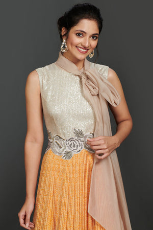 Shop beautiful silver and light orange pleated gown online in USA with scarf. Make a fashion statement on festive occasions and weddings with palazzo suits, sharara suits, partywear dresses, salwar suits from Pure Elegance Indian fashion store in USA.-closeup