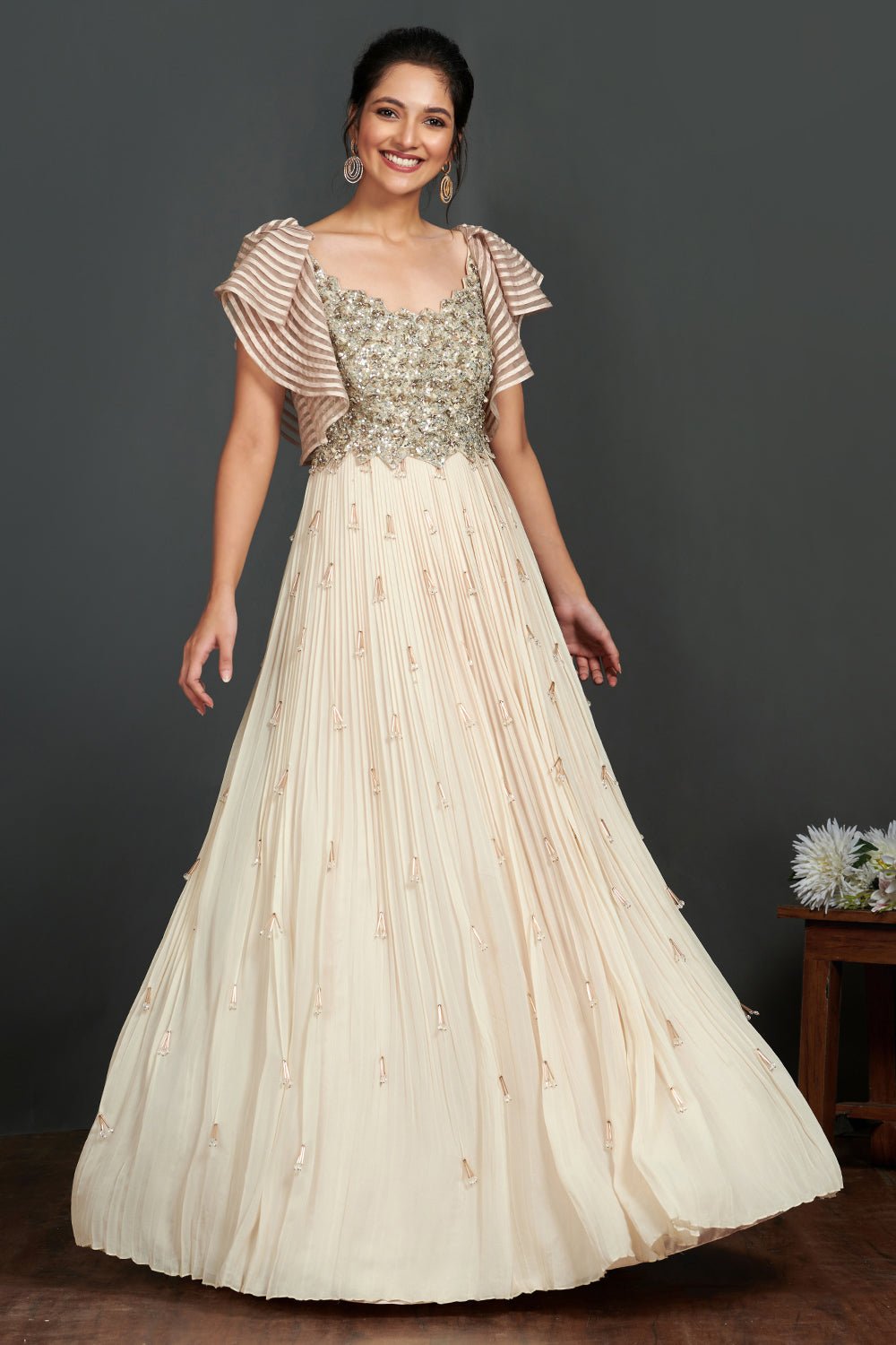 Shop stunning ivory georgette gown online in USA with sequin work bustier. Make a fashion statement on festive occasions and weddings with designer suits, Indian dresses, Anarkali suits, palazzo suits, designer gowns, sharara suits from Pure Elegance Indian fashion store in USA.-full view