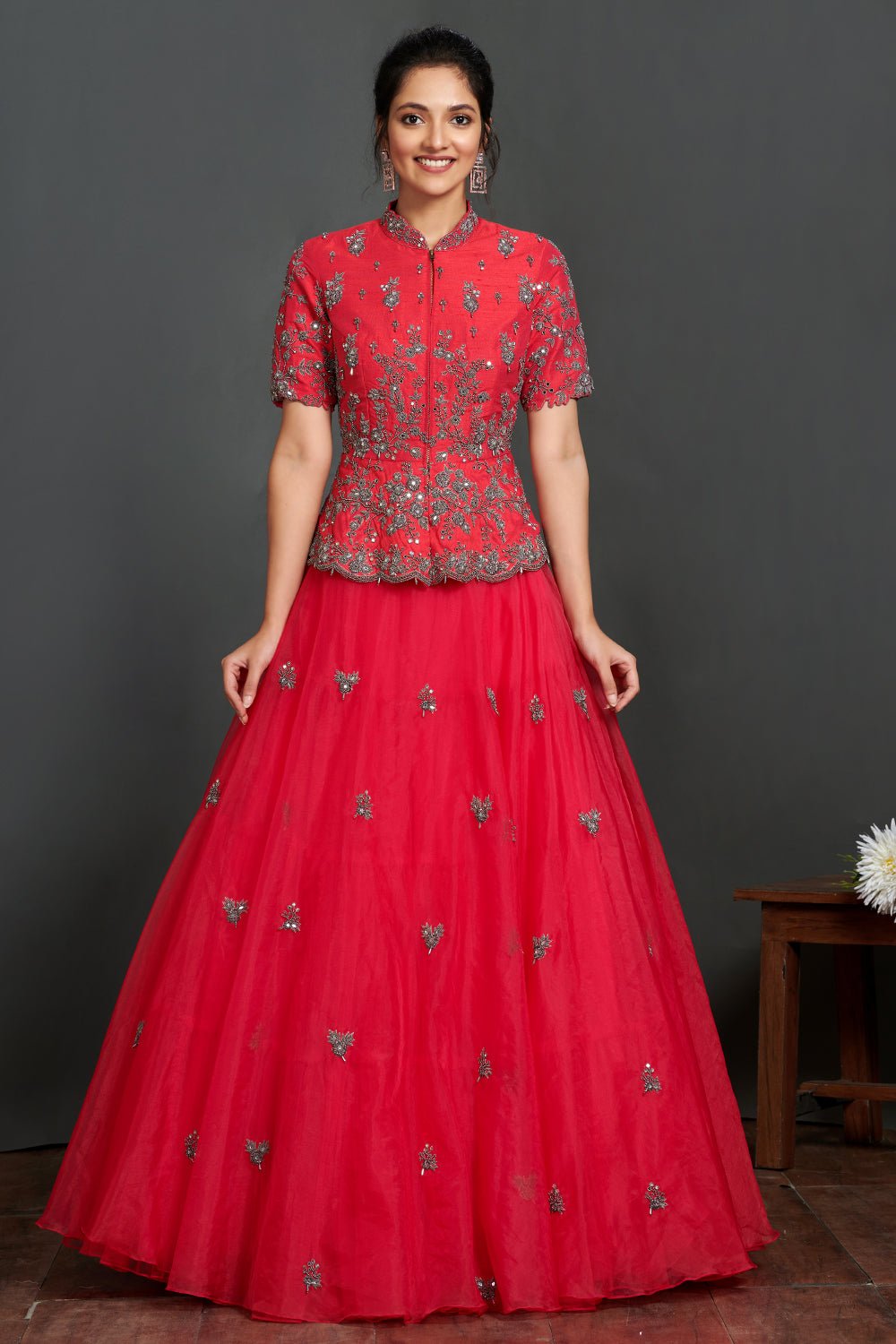 Buy stunning fushchia pink embroidered organza skirt online in USA with peplum blouse. Make a fashion statement on festive occasions and weddings with palazzo suits, sharara suits, partywear dresses, salwar suits from Pure Elegance Indian fashion store in USA.-full view