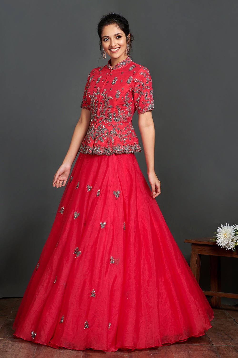 Buy stunning fushchia pink embroidered organza skirt online in USA with peplum blouse. Make a fashion statement on festive occasions and weddings with palazzo suits, sharara suits, partywear dresses, salwar suits from Pure Elegance Indian fashion store in USA.-left