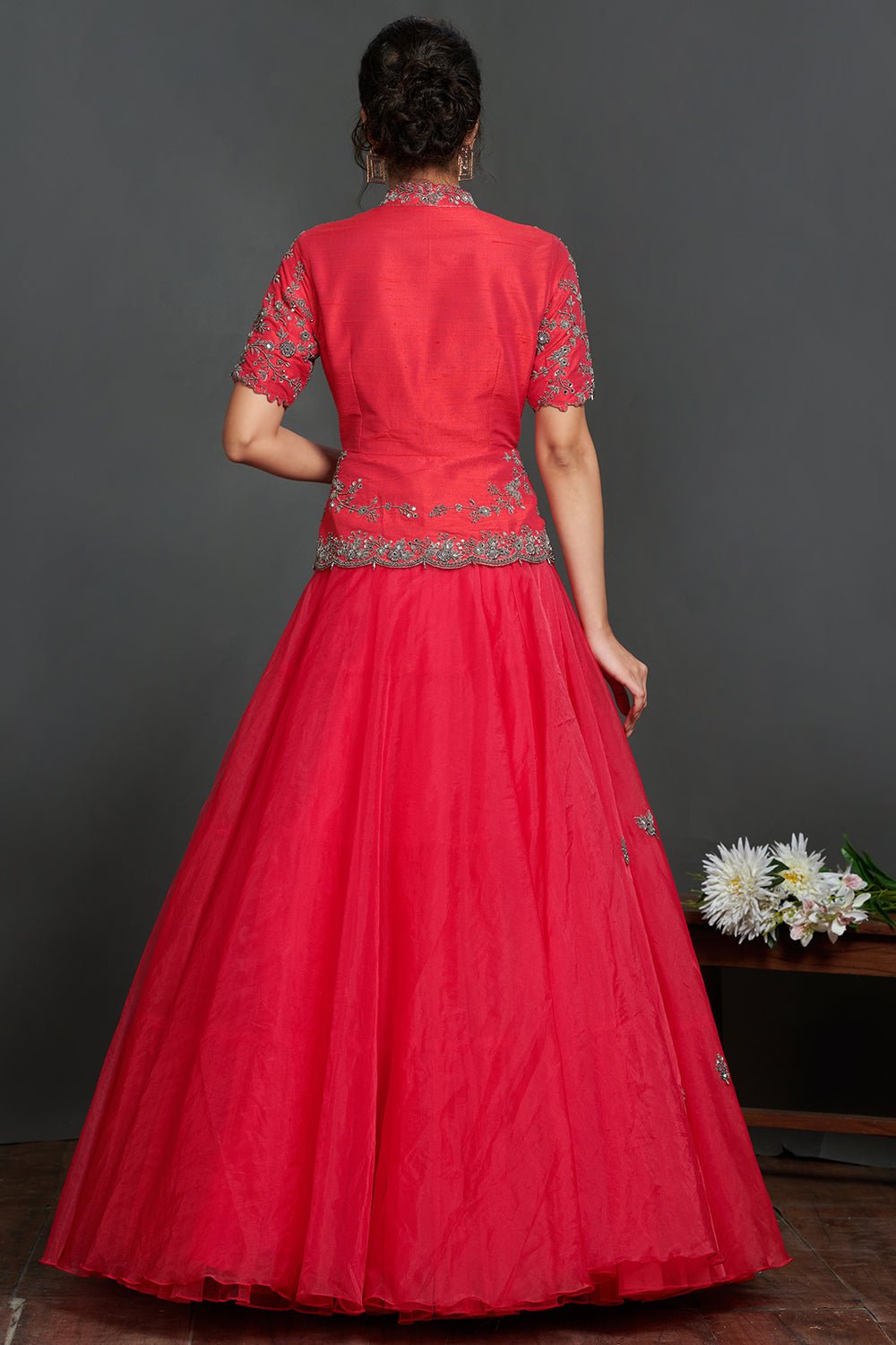 Buy stunning fushchia pink embroidered organza skirt online in USA with peplum blouse. Make a fashion statement on festive occasions and weddings with palazzo suits, sharara suits, partywear dresses, salwar suits from Pure Elegance Indian fashion store in USA.-back
