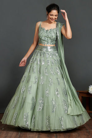 Shop gorgeous sage green organza lehenga online in USA with crop blouse and dupatta. Make a fashion statement on festive occasions and weddings with designer suits, Indian dresses, Anarkali suits, palazzo suits, designer gowns, sharara suits from Pure Elegance Indian fashion store in USA.-front