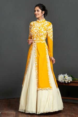 Shop stunning yellow and cream embroidered kurta online in USA with lehenga. Make a fashion statement on festive occasions and weddings with palazzo suits, sharara suits, partywear dresses, salwar suits from Pure Elegance Indian fashion store in USA.-left
