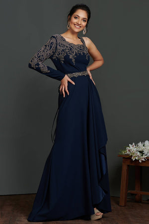 Buy beautiful navy blue antique golden embroidery asymmetric gown online in USA. Make a fashion statement on festive occasions and weddings with palazzo suits, sharara suits, partywear dresses, salwar suits from Pure Elegance Indian fashion store in USA.-left