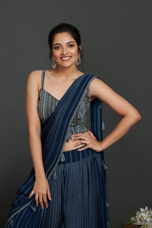 Buy beautiful cobalt blue pant saree online in USA with 3D embellished saree blouse. Make a fashion statement on festive occasions and weddings with designer suits, Indian dresses, Anarkali suits, palazzo suits, designer gowns, sharara suits from Pure Elegance Indian fashion store in USA.-closeup