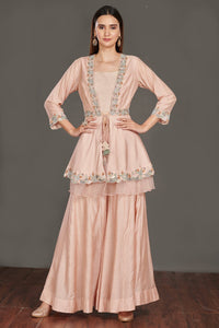 Shop beautiful light pink embroidered peplum jacket online in USA with flared palazzo. Make a fashion statement on festive occasions and weddings with palazzo suits, sharara suits, partywear dresses, salwar suits from Pure Elegance Indian fashion store in USA.-full view