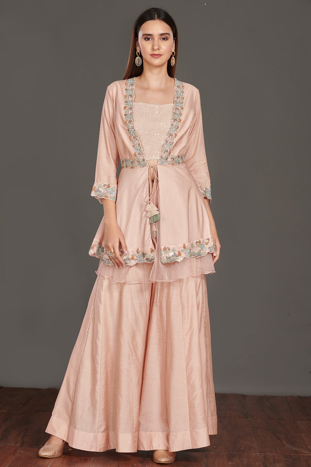 Shop beautiful light pink embroidered peplum jacket online in USA with flared palazzo. Make a fashion statement on festive occasions and weddings with palazzo suits, sharara suits, partywear dresses, salwar suits from Pure Elegance Indian fashion store in USA.-front