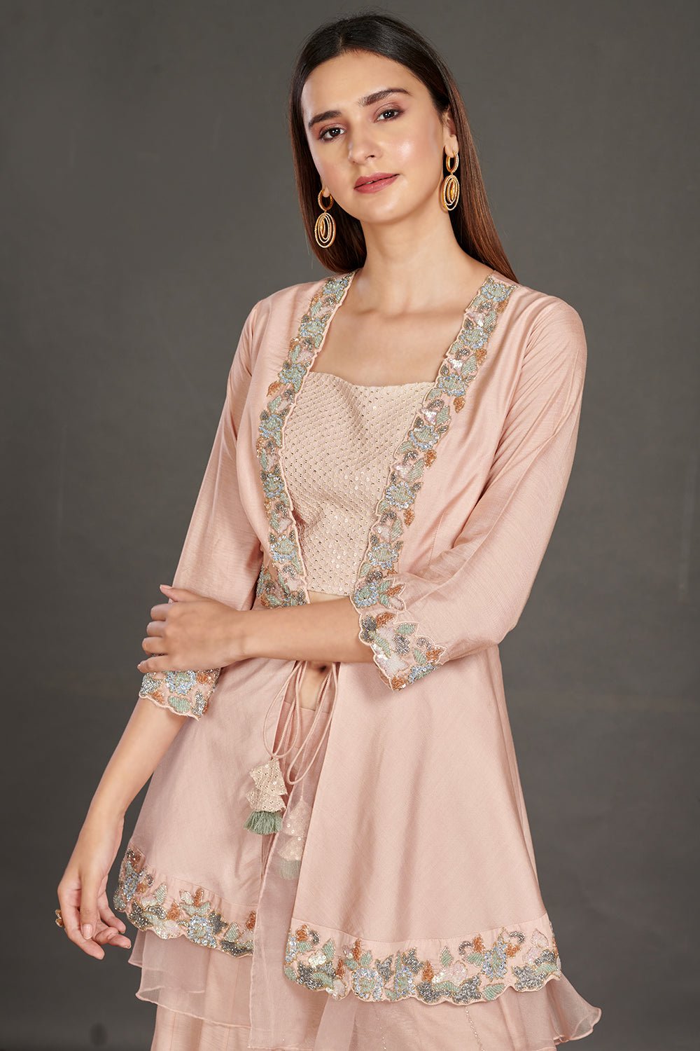 Shop beautiful light pink embroidered peplum jacket online in USA with flared palazzo. Make a fashion statement on festive occasions and weddings with palazzo suits, sharara suits, partywear dresses, salwar suits from Pure Elegance Indian fashion store in USA.-closeup
