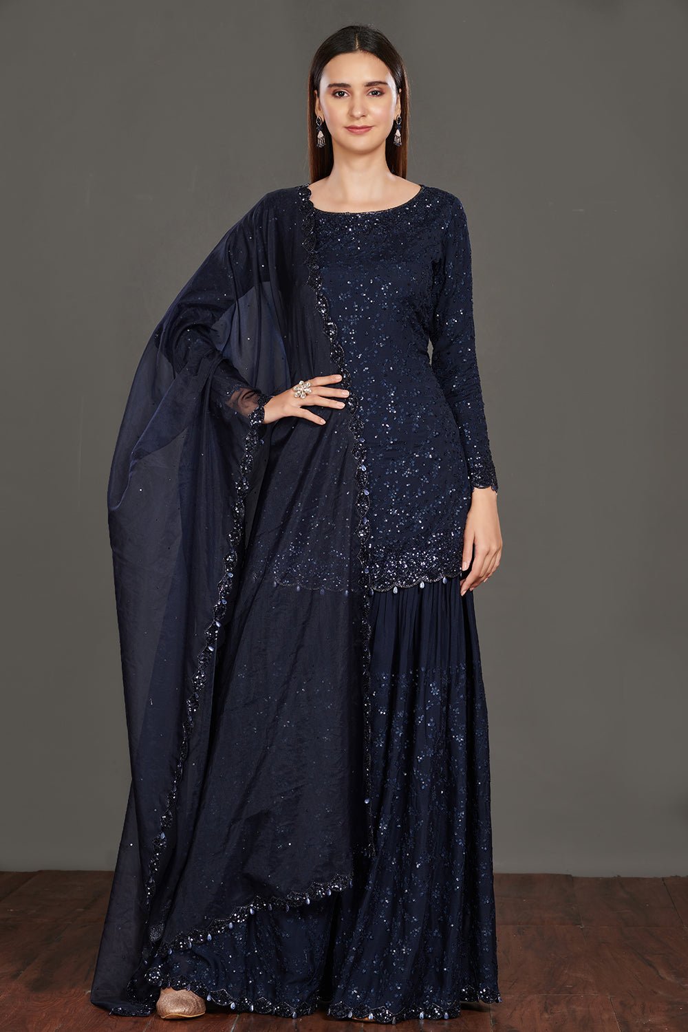 Buy stunning navy blue shimmer sharara suit online in USA. Make a fashion statement on festive occasions and weddings with palazzo suits, sharara suits, partywear dresses, salwar suits from Pure Elegance Indian fashion store in USA.-full view