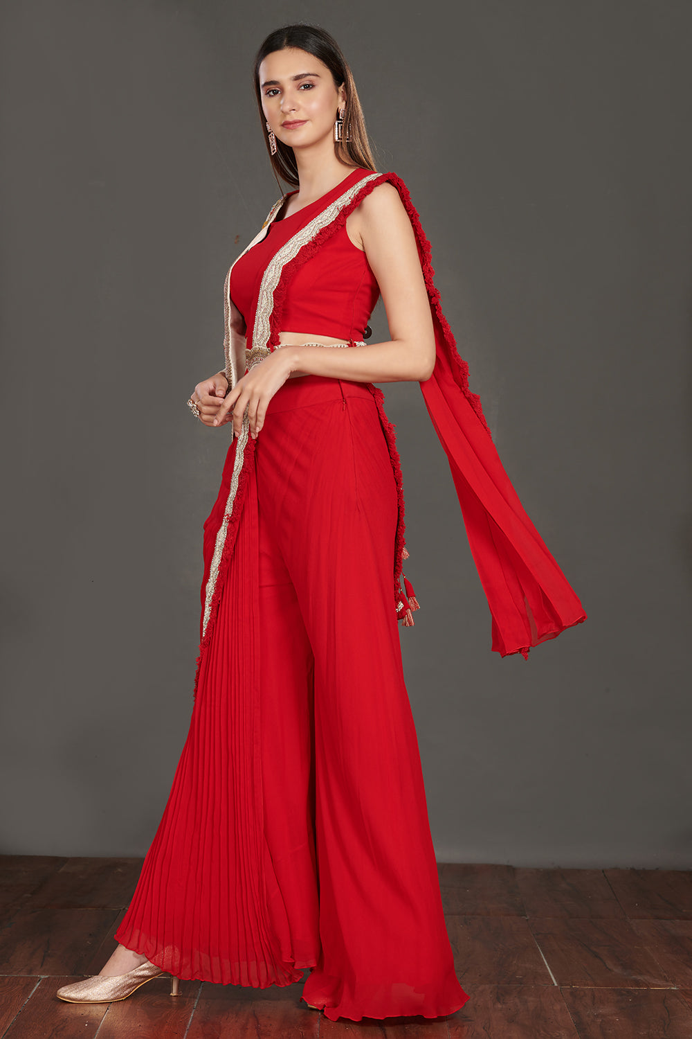  Buy stunning red pant saree online in USA with one sided embroidered jacket. Make a fashion statement on festive occasions and weddings with designer suits, Indian dresses, Anarkali suits, palazzo suits, designer gowns, sharara suits from Pure Elegance Indian fashion store in USA.-left