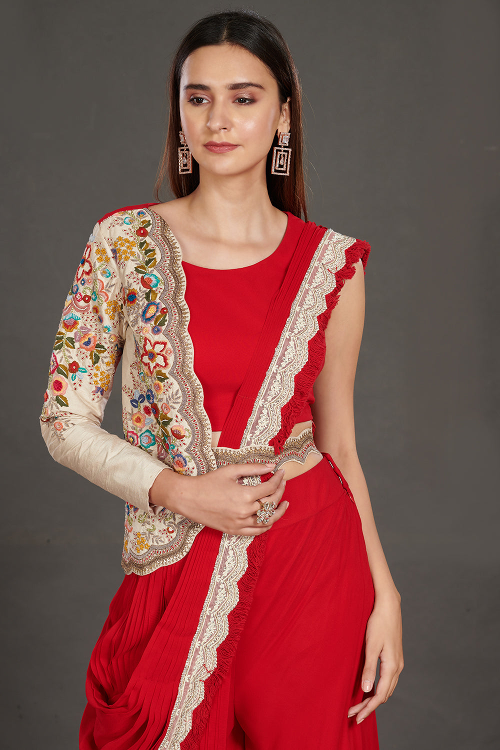  Buy stunning red pant saree online in USA with one sided embroidered jacket. Make a fashion statement on festive occasions and weddings with designer suits, Indian dresses, Anarkali suits, palazzo suits, designer gowns, sharara suits from Pure Elegance Indian fashion store in USA.-closeup
