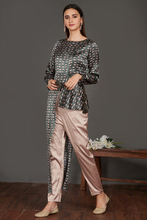 Buy stunning grey asymmetric printed satin tunic online in USA with beige pants. Make a fashion statement on festive occasions and weddings with palazzo suits, sharara suits, partywear dresses, salwar suits from Pure Elegance Indian fashion store in USA.-left