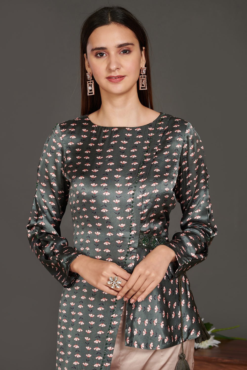 Buy stunning grey asymmetric printed satin tunic online in USA with beige pants. Make a fashion statement on festive occasions and weddings with palazzo suits, sharara suits, partywear dresses, salwar suits from Pure Elegance Indian fashion store in USA.-top