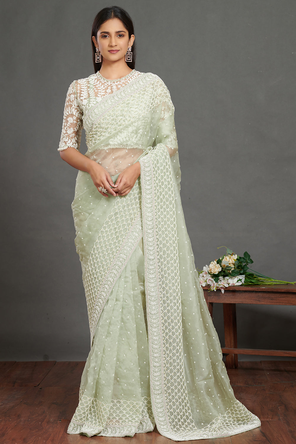 Shop mint green self embroidered saree online in USA with green lace saree blouse. Make a fashion statement on festive occasions and weddings with designer suits, Indian dresses, Anarkali suits, palazzo suits, designer gowns, sharara suits from Pure Elegance Indian fashion store in USA.-front