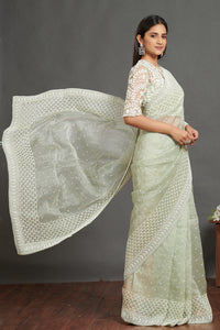 Shop mint green self embroidered saree online in USA with green lace saree blouse. Make a fashion statement on festive occasions and weddings with designer suits, Indian dresses, Anarkali suits, palazzo suits, designer gowns, sharara suits from Pure Elegance Indian fashion store in USA.-full view