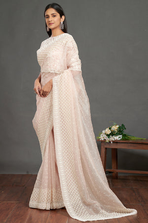 Shop gorgeous light pink lace saree online in USA with self-work saree blouse. Make a fashion statement on festive occasions and weddings with designer sarees, embroidered saris, handwoven saris, party wear sarees from Pure Elegance Indian fashion store in USA.-pallu