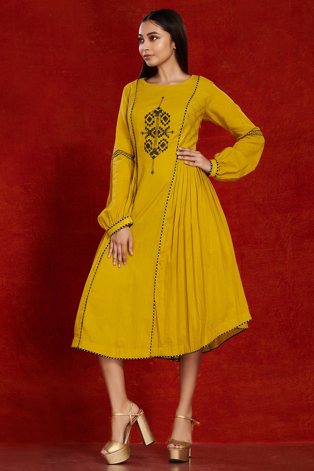 Shop stunning mustard side pleated cotton midi dress online in USA. Make a fashion statement on festive occasions and weddings with palazzo suits, sharara suits, partywear dresses, salwar suits from Pure Elegance Indian fashion store in USA.-left