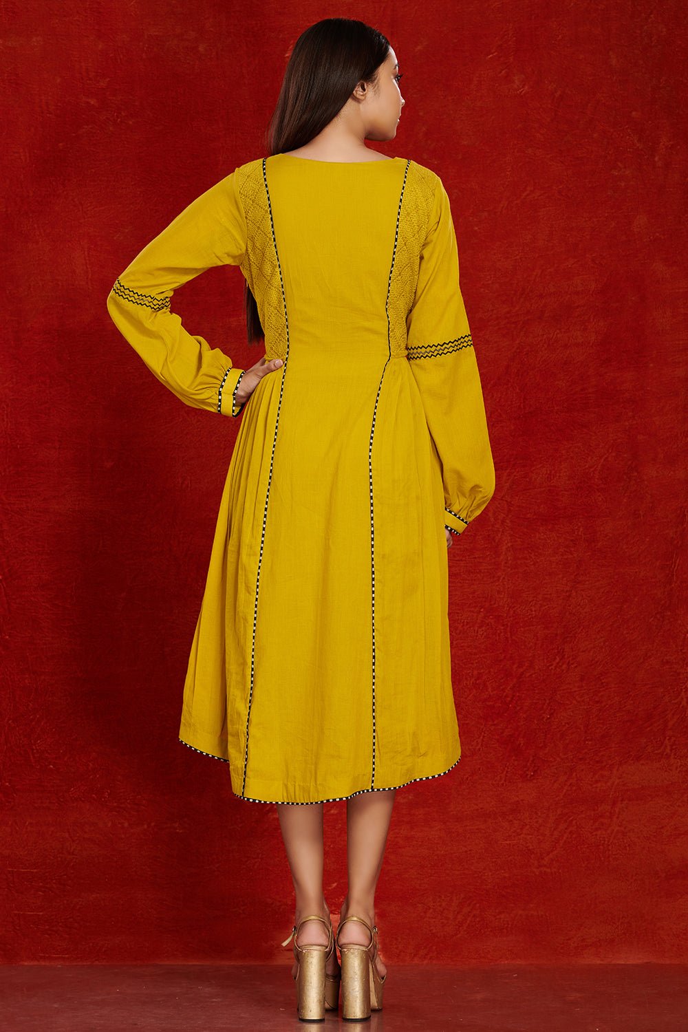 Shop stunning mustard side pleated cotton midi dress online in USA. Make a fashion statement on festive occasions and weddings with palazzo suits, sharara suits, partywear dresses, salwar suits from Pure Elegance Indian fashion store in USA.-back