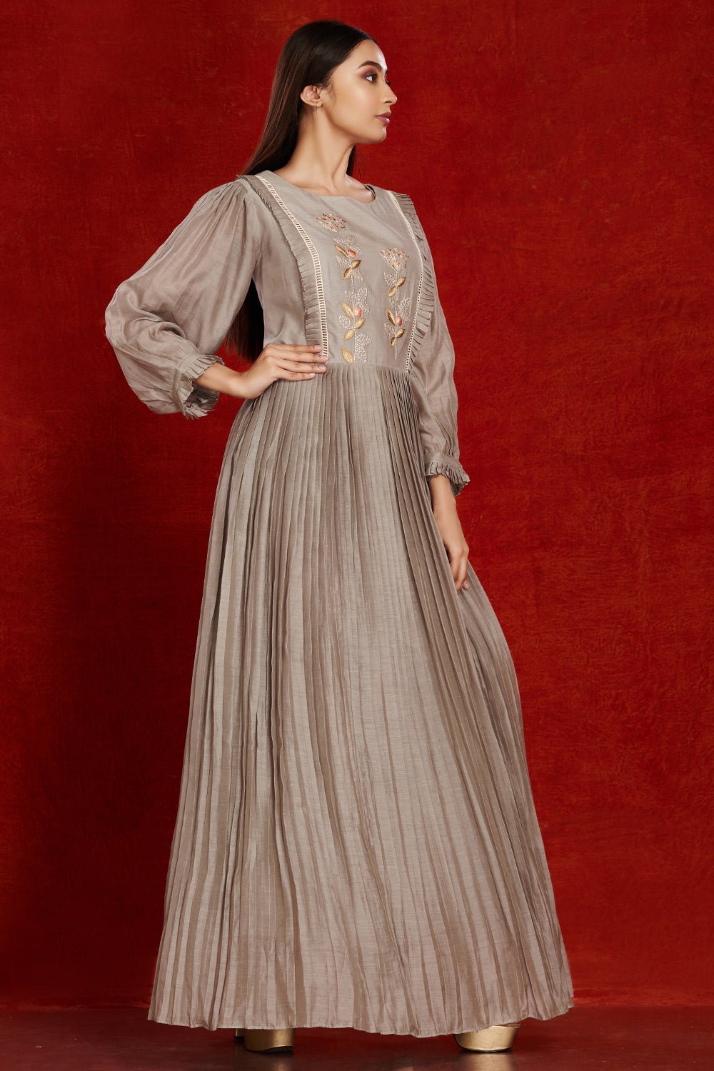 Buy stunning grey balloon sleeves muslin gown online in USA with pastel embroidery. Make a fashion statement on festive occasions and weddings with palazzo suits, sharara suits, partywear dresses, salwar suits from Pure Elegance Indian fashion store in USA.-right