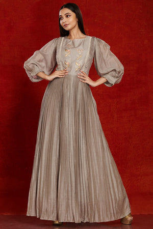 Buy stunning grey balloon sleeves muslin gown online in USA with pastel embroidery. Make a fashion statement on festive occasions and weddings with palazzo suits, sharara suits, partywear dresses, salwar suits from Pure Elegance Indian fashion store in USA.-front
